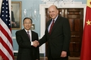 Deputy Secretary of State John Negroponte, right, welcomes China's Executive Vice Foreign Minister Dai Bingguo for talks at the State Department in Washington, Wednesday, June 20, 2007. (AP Photo/J. Scott Applewhite)