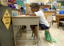 First grader Salima Sapateh, 6, finishes her class work at Arrowhead Elementary School in Upper Marlboro, Md., Monday, April 23, 2007. John Deasy, superintendent of schools in Prince George's County, Md., acknowledges the atmosphere at Arrowhead is more intense than at schools that aren't facing restructuring. (AP Photo/Kevin Wolf)